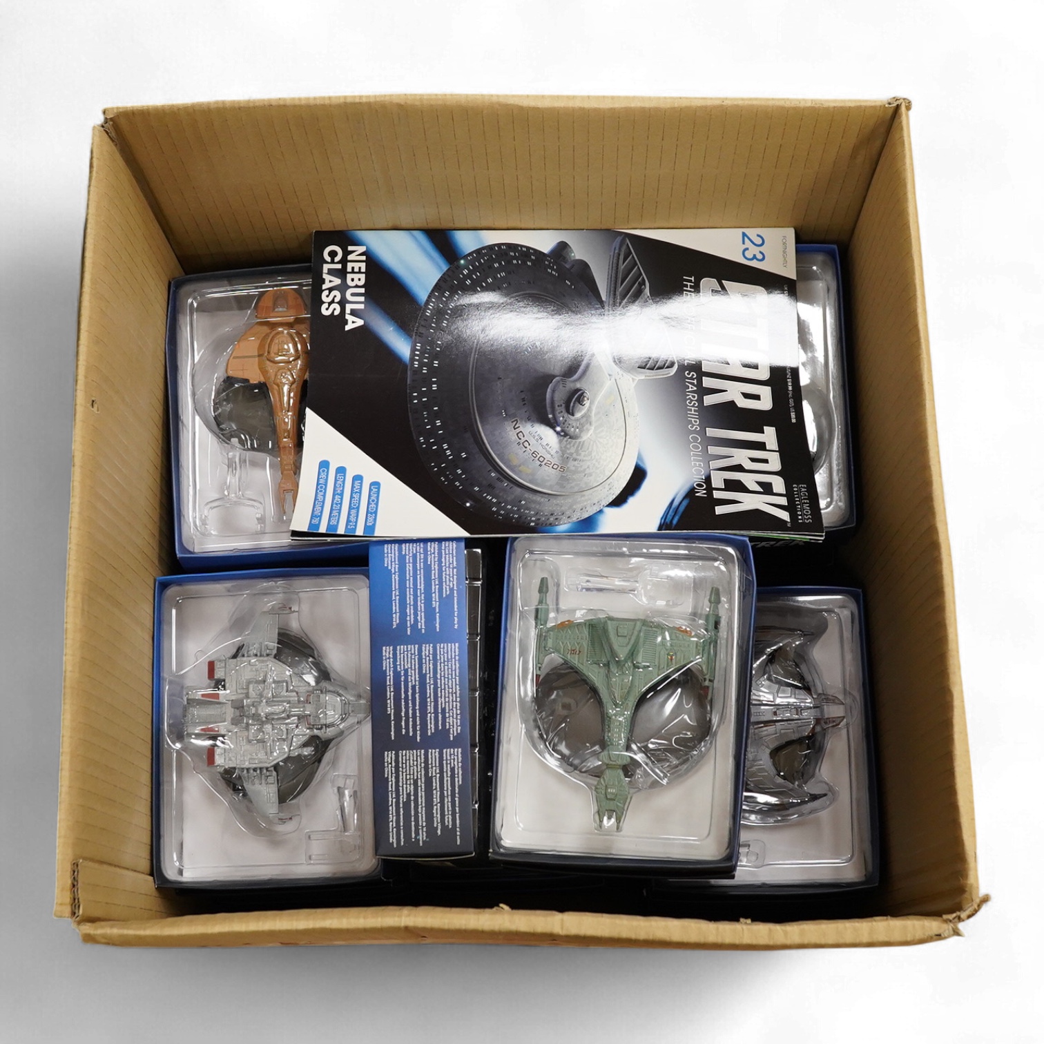 Twenty-five boxed Star Trek Eaglemoss Collections magazine issue starship models, with the associated magazines (unchecked)